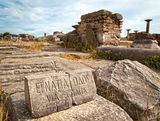 Stone marker of the Via Traiana in the archaeological park of Egnazia