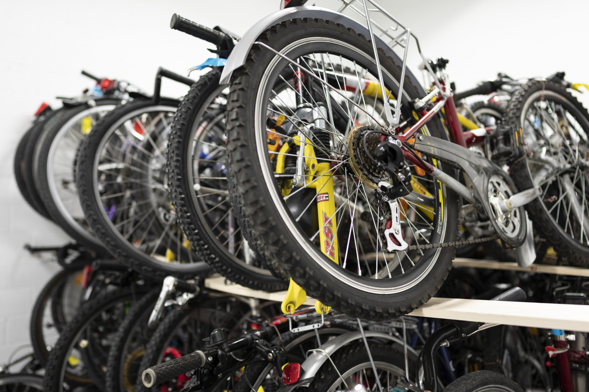 Rental bikes lined up on a storage rack