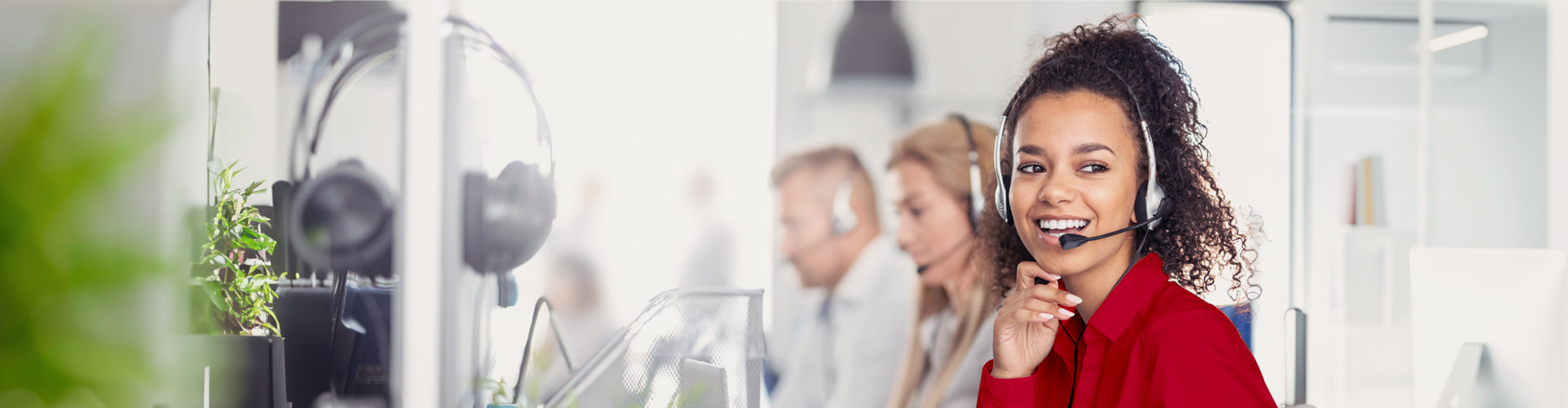 Customer service assistant answering a call with a headset