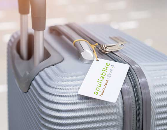 Suitcase with an Apulia Bike Tours luggage label