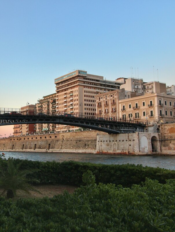 Swing bridge and old town of Taranto at sunset