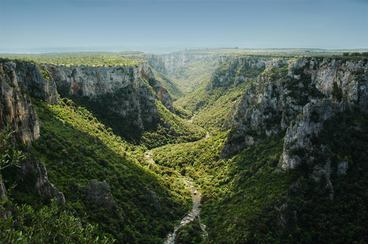 Hikers on the trail in the Laterza ravine, Puglia