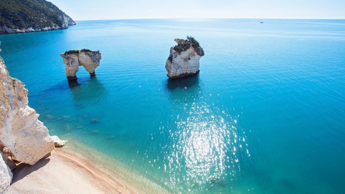 Sea stacks and turquoise water on the Gargano coast near Mattinata